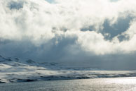 Clouds in the Sunlight / Big skies and snow cover tandra along Isfjorden, Svalbard