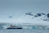 Ship against teh Glacier / Our ship sailing in front of the glacier at Samarinvågen / Brepollen, Svalbard