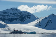 Ship and Iceberg / Our ship and zodiacs near an iceberg at Burgerbukta / Brepollen, Svalbard
