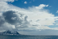 Big Sky and Clouds / Big sky and clounds above a peak at Isbjørnhamna, Svalbard