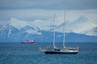 Passing boats / Sail boat and ship passing near Alkhornet, Svalbard